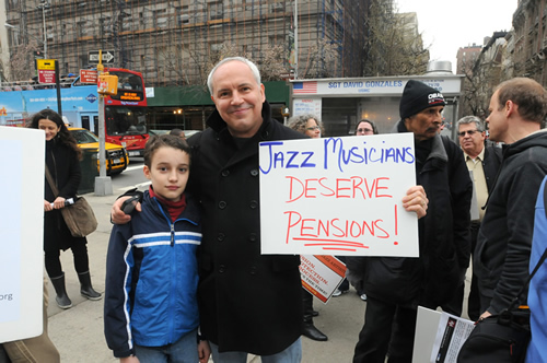 PENSION, YES! Local 802 Executive Board member Bud Burridge and his son Kai at a Local 802 jazz campaign rally earlier this spring. Pension is one of the main demands. Photo: Walter Karling
