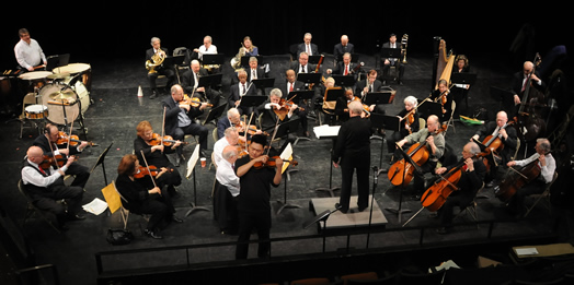 EXPERIENCE MATTERS: Musicians in the Senior Concert Orchestra rehearse for their annual free concert. The orchestra just negotiated an agreement that will allow them to return to Carnegie Hall for subsequent concerts. Photos by Walter Karling.