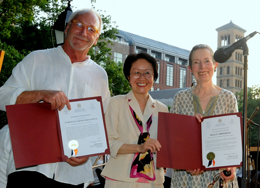 NYC Council Member Margaret Chin (middle) hands out official citations of appreciation to Lutz Rath (festival music director and conductor) and Peggy Friedman (executive director of the festival).
