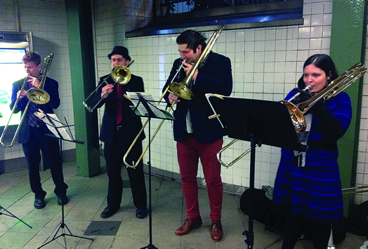 THE JOY OF BUSKING: From left, Jacob Elkin, Ric Becker, David Whitwell and Becca Patterson play on a subway platform.