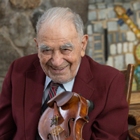 AT THE HEIGHT OF HIS POWERS: Local 802 member Edward Simons turns 98 on Feb. 1. He may be the oldest working orchestra conductor on the world. Photos: Stan Kurtis