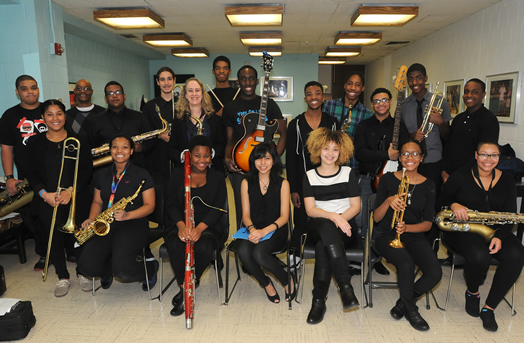 THE NEXT GENERATION: Local 802 member Janet Grice (standing above the bassoonist) teaches music at the Fordham School for the Arts in the Bronx. The student musicians in this article were photographed at a recent concert that the Fordham jazz band gave at Lehman College. Photos by Walter Karling.