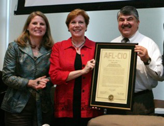 Roberta Reardon receiving the official charter of the new SAG-AFTRA merged union.