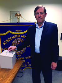 Financial Vice President Tom Olcott casts the ceremonial ballot in this year's unopposed Local 802 elections. A bylaw proposal has been submitted to the upcoming Feb. 10 membership meeting that will codify into the union's bylaws how Local 802 handles unopposed elections.