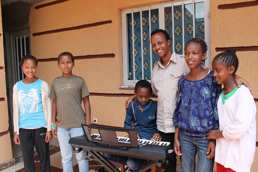 Biniyam Bekele teaches piano, guitar and bass guitar to students at Lelt's Community Center.