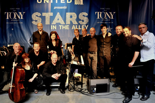 LEFT SIDE OF PHOTO: Sitting, left to right: Dan Willis, Amy Ralske, John Chudoba, Dale Kirkland. Standing behind them: Aaron Heick, Hiroko Taguchi. RIGHT SIDE OF PHOTO: Standing, left to right: Michael Aarons, Ray Marchica Randy Landau, Ben Cohn, Matt Doebler, Dominic Amendum, Michael Keller