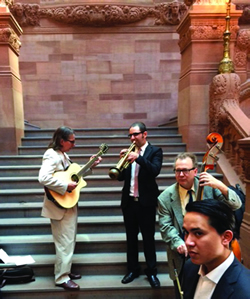 Musicians from AFM Local 14 warm up before performing at a press conference outside the Capitol Building in Albany in support of the Empire State Music Production Tax Credit.
